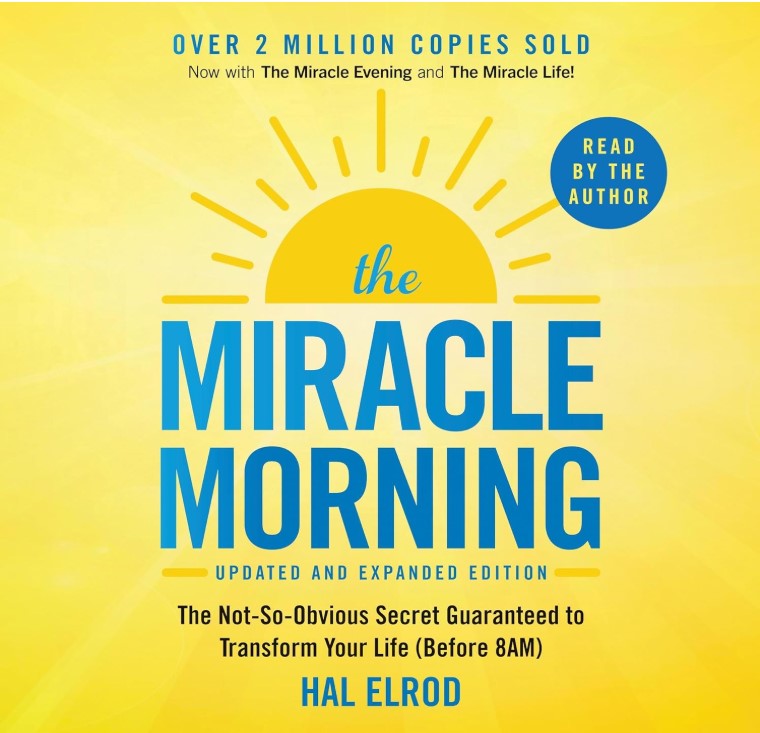 "Book cover of 'The Miracle Morning' by Hal Elrod, a bestselling self-improvement book. The design features a bright yellow background with a rising sun illustration. The title is in bold blue letters, and the subtitle reads, 'The Not-So-Obvious Secret Guaranteed to Transform Your Life (Before 8 AM).' This book focuses on morning routines, productivity, personal growth, and success habits."